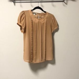 Embroidered collar and pleated detail down front